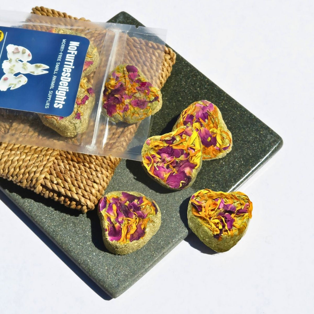 Hayflower Minicakes heart-shaped hay treats topped with rose and calendula petals for rabbits, guinea pigs, and other small a