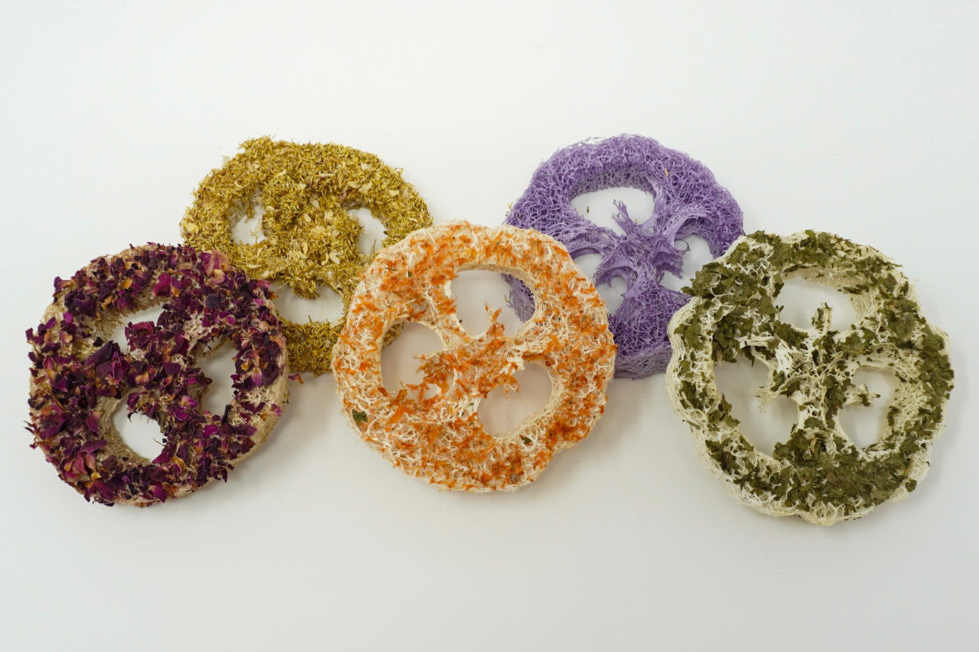 Colorful loofah chew rings arranged together for small pets