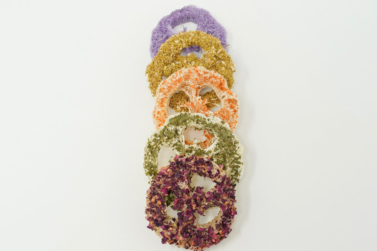 Flavored loofah chews stacked in a tower for small animal chewing